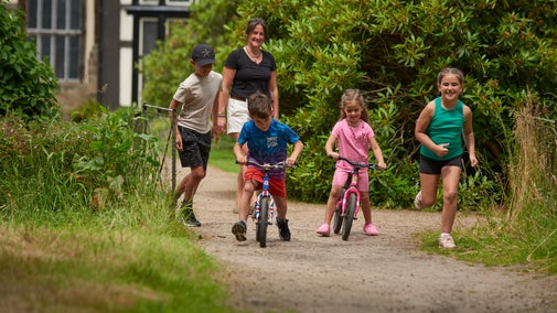Children enjoying the balance bikes at Rufford Old Hall